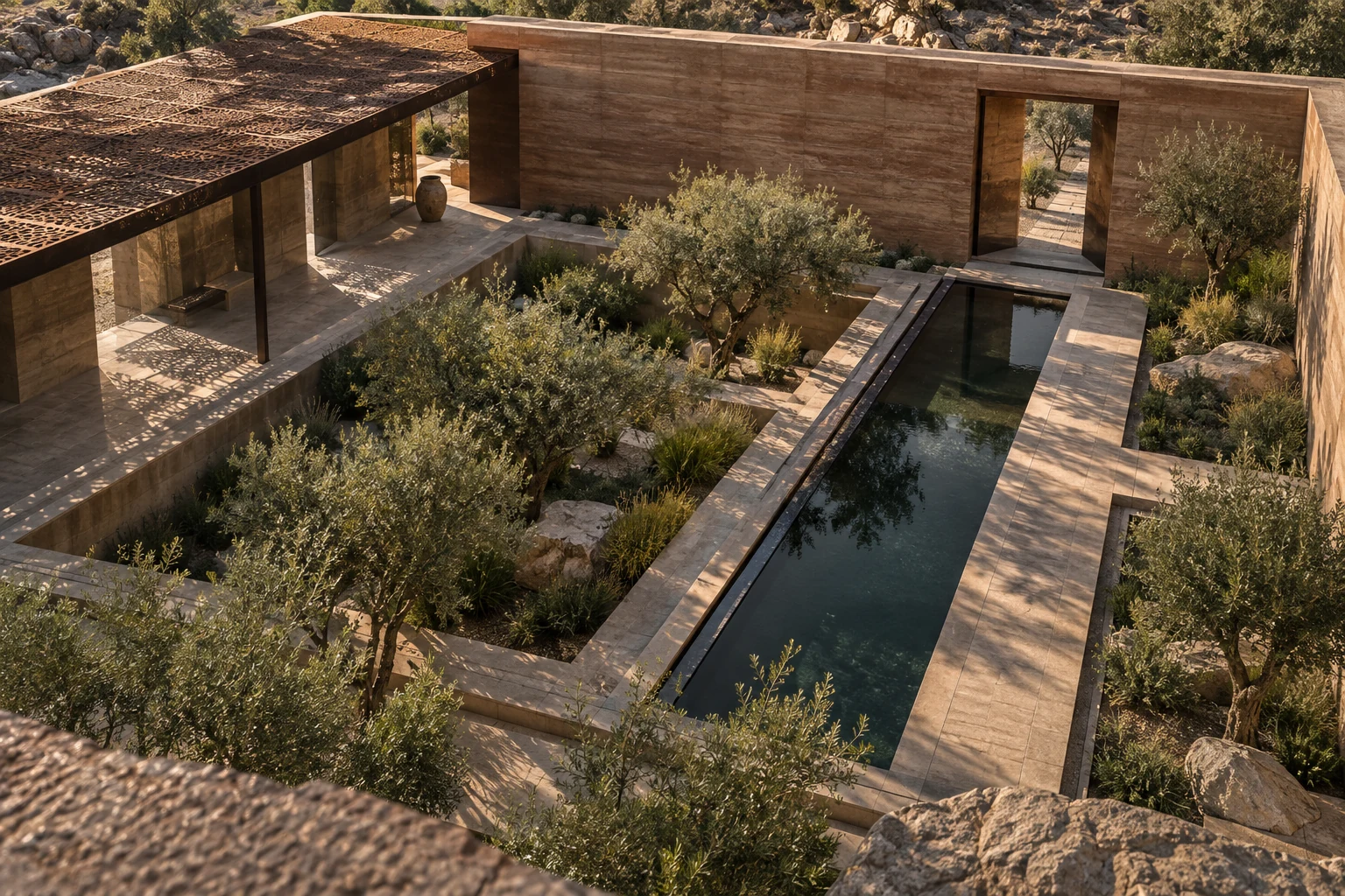 Earth-walled courtyard with a long water channel and olive trees on a dry hillside.